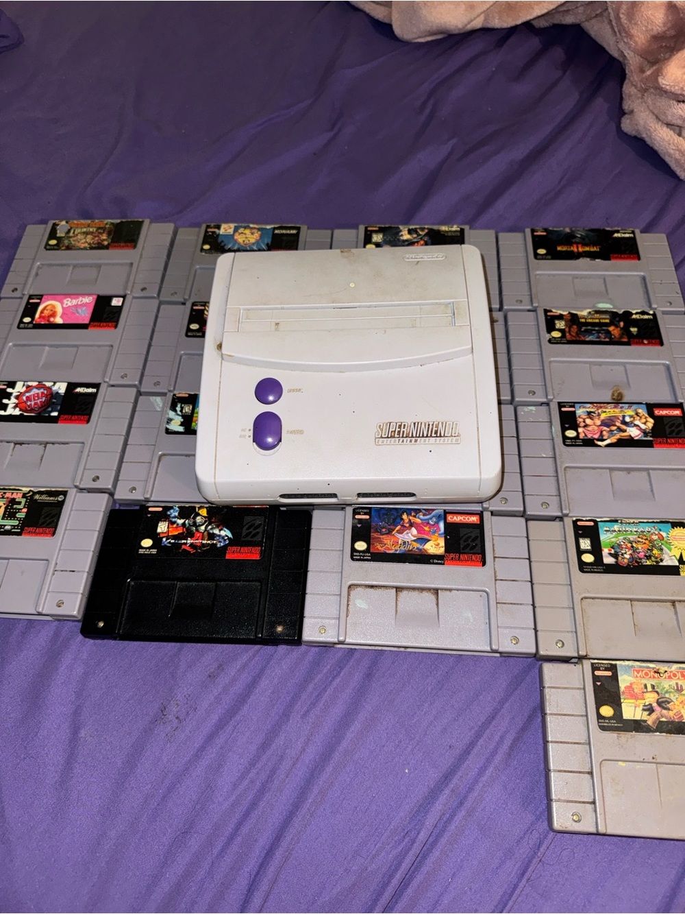 Super Nintendo Jr. with A lot of SNES game cartridges